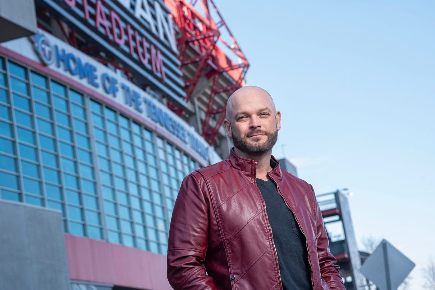 Paul Scott of KW Music City standing on the field at Nissan Stadium in Nashville
