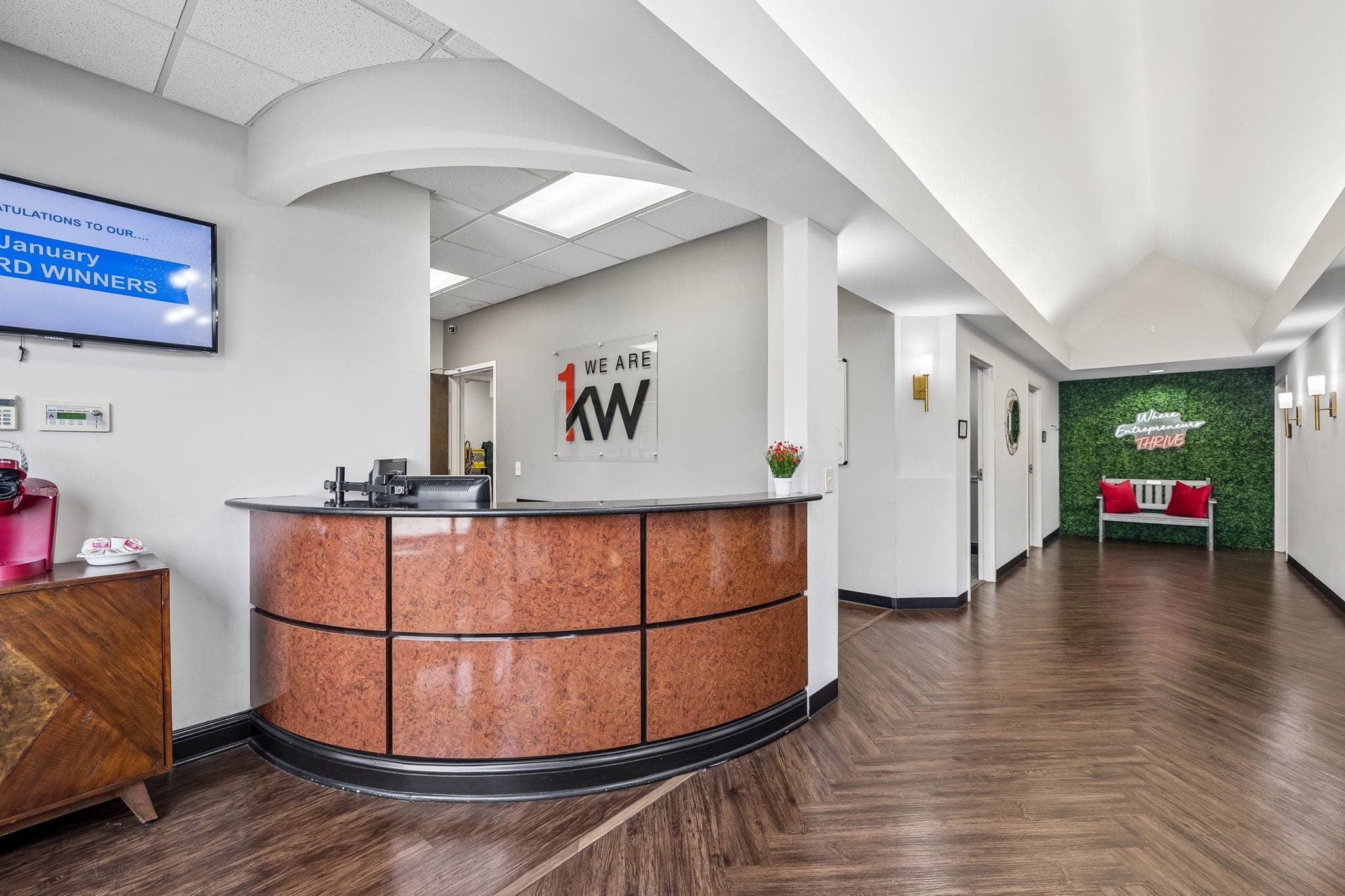 The curved reception desk inside Keller Williams Murfreesboro