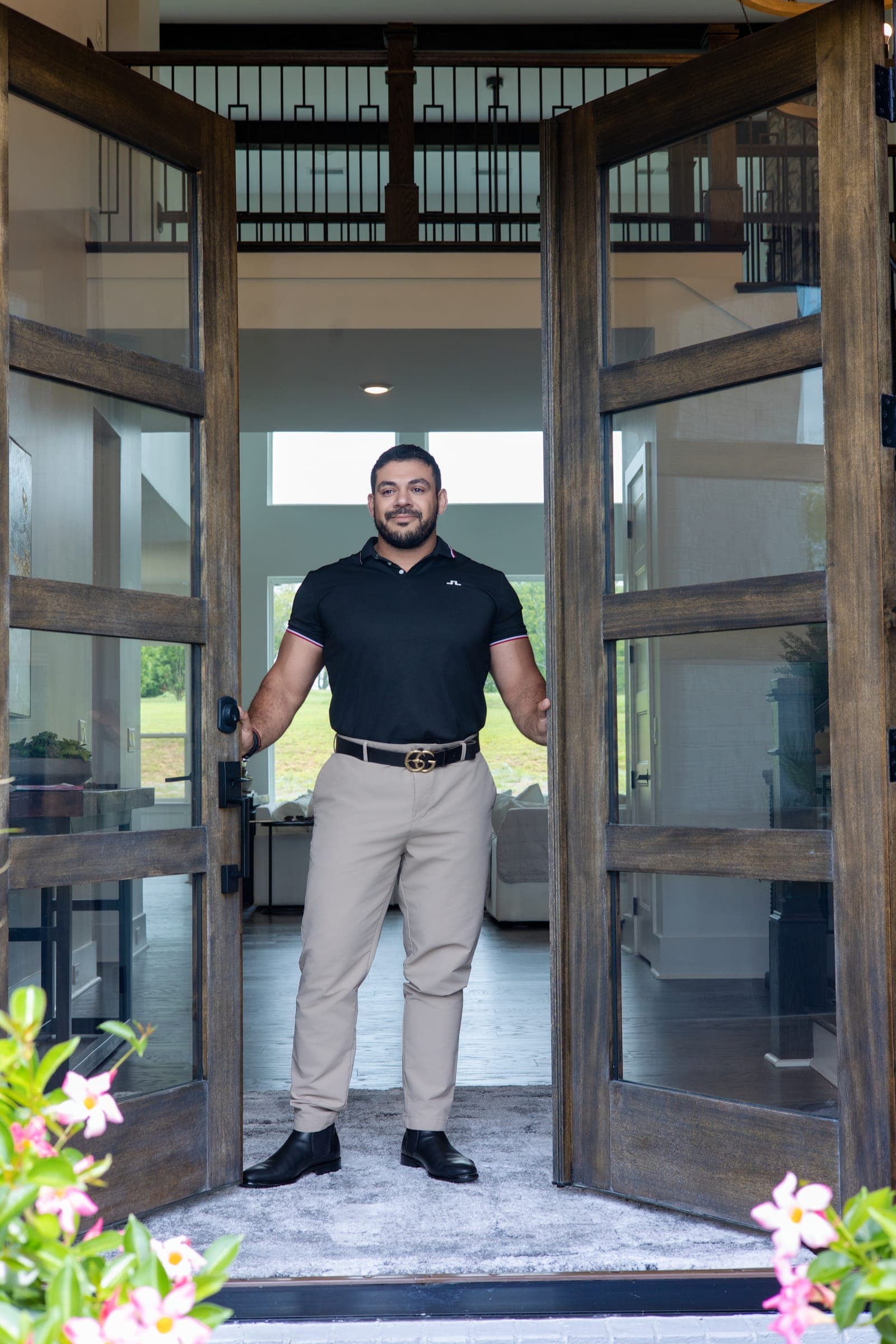 An Empower agent holding both doors open — the welcome waiting at your next office
